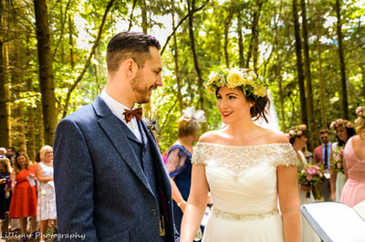 Bride and groom exchanging wedding vows during woodland wedding ceremony

West Midlands Wedding Photographer