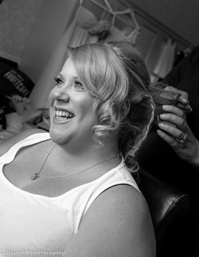 Bride smiling during bridal preparations on her wedding day, by Lilliput Photography, West Midlands Wedding Photographer